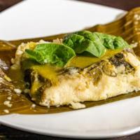 Oaxaqueno Veggie Tamale · Our veggie Tamale has spinach, green pepper and onions.