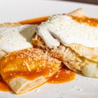 Chicken Quesadilla · Marinated chicken season and sautéed. Includes jack cheese, hot sauce and sour cream.