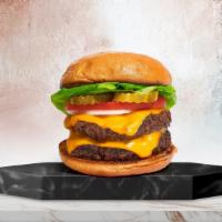 Beyond Double Decker Burger · Two plant-based beyond meat meat patties topped with melted vegan cheddar cheese, grilled on...