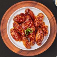 Korean Drama Wings · Fresh chicken wings breaded, fried until golden brown, and tossed in soy sauce, brown sugar,...
