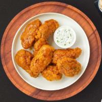 Habanero Flame Wings · Fresh chicken wings breaded, fried until golden brown, and tossed in mango habanero sauce. S...
