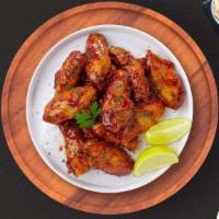 Honey Smokes Bbq Wings · Fresh chicken wings breaded, fried until golden brown, and tossed in honey and barbecue sauc...