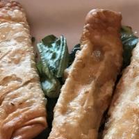 Sigara Borek · Lightly pan-fried phyllo rolls stuffed with feta cheese.