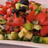 Çoban Salad · Fresh chopped tomatoes, onions, cucumbers, green peppers, parsley and house dressing. Served...