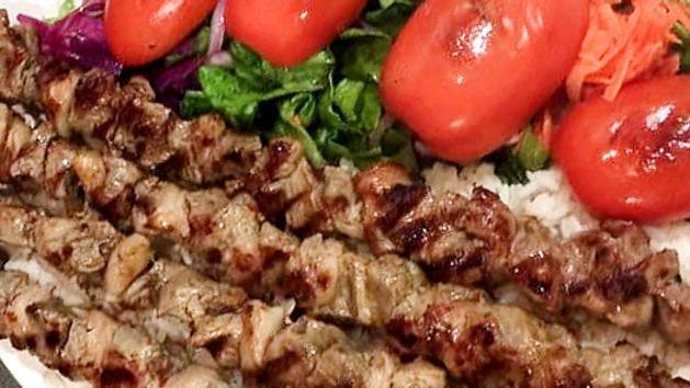 Kofta Kebab · Char grilled ground lamb patties seasoned with Turkish spices and served over rice and salad.
