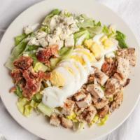 Cobb Salad · Iceberg lettuce with grilled chicken, crumbled Bleu cheese, chopped bacon and sliced hard-bo...