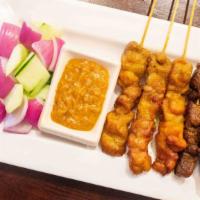 Penang Satay · Spicy. Five sticks. Marinated beef or chicken on skewers, charcoal grilled to perfection. Se...