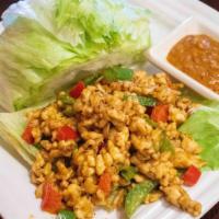 Thai Lettuce Wraps · Spicy. Popular Asian favorite. Thai basil, sliced chicken served with house sauce and fresh ...