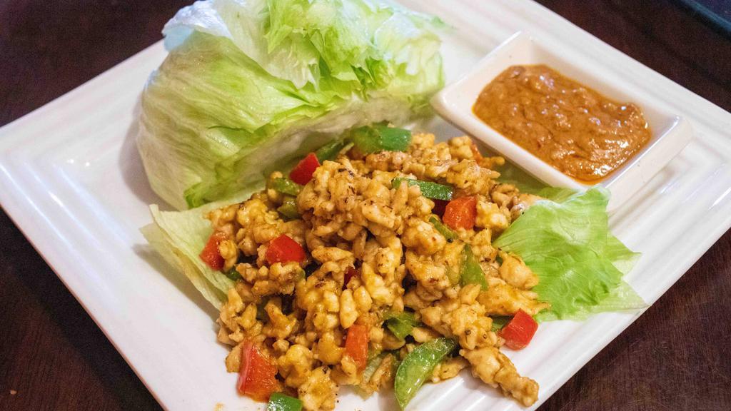 Thai Lettuce Wraps · Spicy. Popular Asian favorite. Thai basil, sliced chicken served with house sauce and fresh lettuce leaves. Spicy.