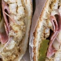 Cuban King Hero Special · Grilled roast pork, ham, Swiss, pickles, and mustards.