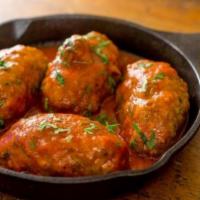Soutzoukakia · Greek meatballs and red wine tomato sauce.