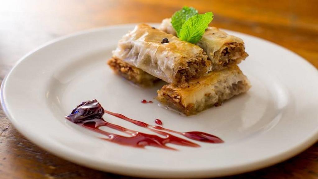Baklava · Layered phyllo with walnuts, spices, and lemon-infused honey syrup.