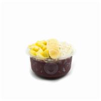 Tropical · Pure acai topped with granola, banana, pineapple, coconut flakes and honey.