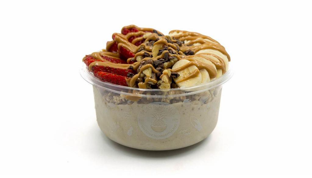 Nica Bowl · Banana blend topped with granola, banana, strawberry, walnuts, raw cacao nibs and peanut butter.
