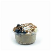 Olas Bowl · Banana blend topped with granola, banana, blueberry, coconut flakes, chia seeds and almond b...