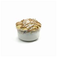 Coco Power · Coconut blend with vanilla protein topped with granola banana, coconut flakes, almond butter.