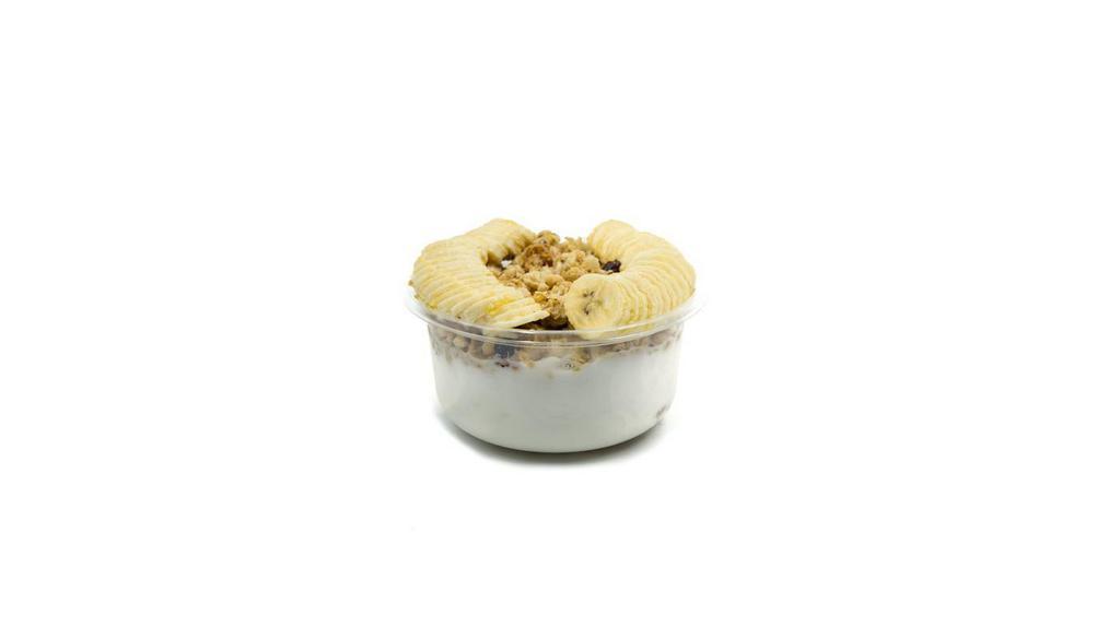 Coco Coconut Bowl · Coconut blend topped with granola, banana, and honey.