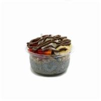 Chia Tella · Chia pudding blend topped with granola, banana, strawberry coconut flakes and Nutella.