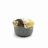 Almond Joy · Chia pudding blend topped with granola, banana, sliced almonds, coconut flakes, raw cacao ni...