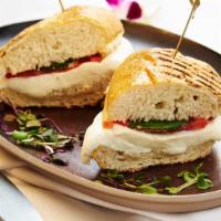 Caprese Sandwich · Toasted panini with pesto, fresh mozzarella di Agerola and tomato.