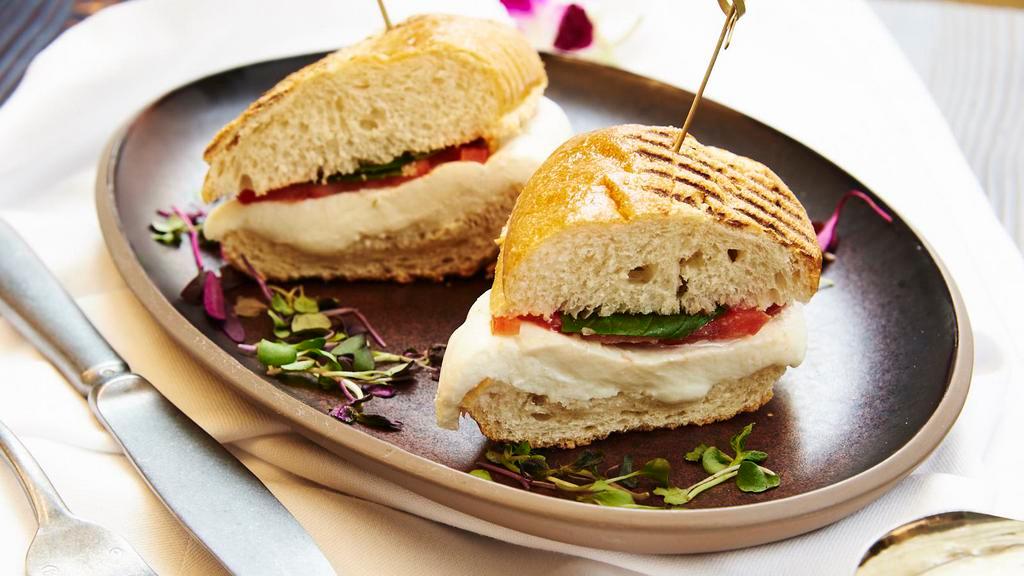 Caprese Sandwich · Toasted panini with pesto, fresh mozzarella di Agerola and tomato.