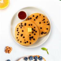 Chocolate Buddy Pancakes · Fluffy chocolate chip pancakes cooked with care and love served with butter and maple syrup....