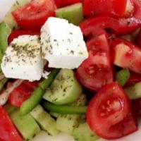 Pathos Greek Salad · Cucumbers, tomatoes, red onions, green peppers, Kalamata olives and feta cheese.