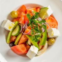 Tomato Salad · Cucumbers, Onions, Peppers, Olives, and Feta Cheese.