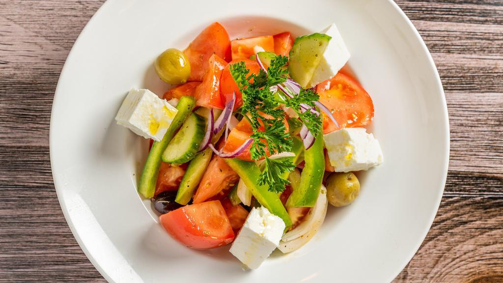 Tomato Salad · Cucumbers, Onions, Peppers, Olives, and Feta Cheese.