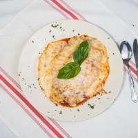 Chicken Parmigiana · Breaded chicken tossed in marinara sauce and covered with cheese.