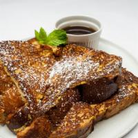 French Toast · Dipped in cinnamon, eggs, milk and vanilla. Served with maple syrup and butter.