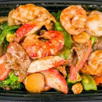 Happy Family · Jumbo shrimp, scallops, beef, chicken, crabmeat with mixed vegetables in chef's special sauce.