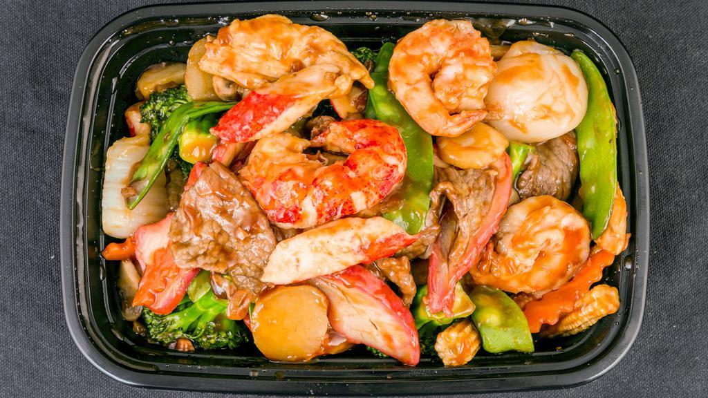 Happy Family · Jumbo shrimp, scallops, beef, chicken, crabmeat with mixed vegetables in chef's special sauce.