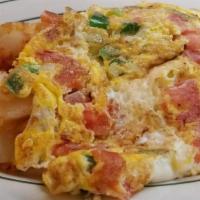 Western Omelet · Ham, onions, and green pepper. Served with choice of home fries or grits & toast.