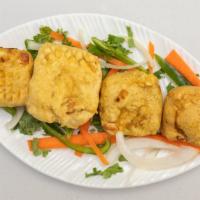 Paneer Pakora · Homemade Indian cheese square, batter dipped & fried till golden, served with chutney.