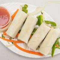 Spring Roll · Golden fried crispy rolls, served with sweet chili sauce.