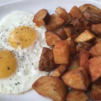 2 Eggs Any Style · Served with roasted breakfast potatoes and toast.
