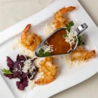 Coconut Shrimp · Jumbo shrimp tossed in shaved coconut & deep-fried, served with a Hennessy apricot dipping s...