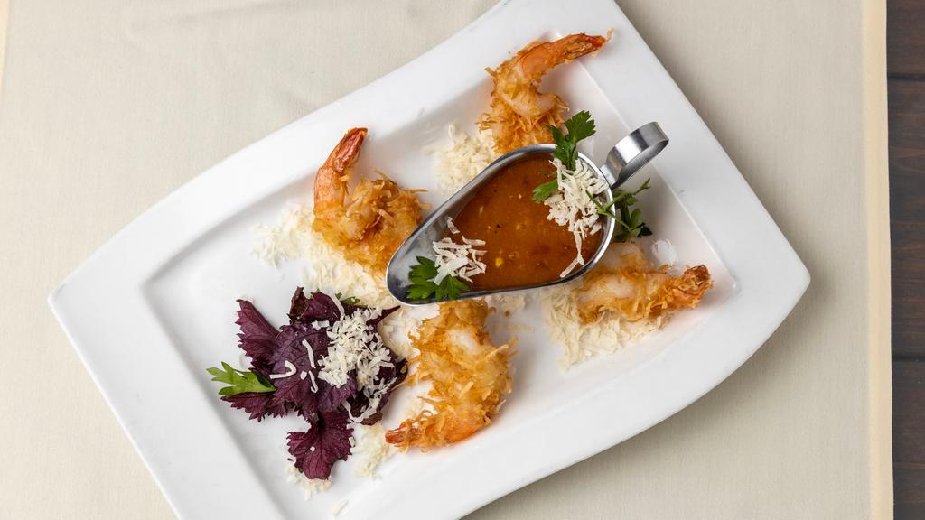 Coconut Shrimp · Jumbo shrimp tossed in shaved coconut & deep-fried, served with a Hennessy apricot dipping sauce.