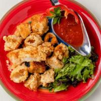 Calamari · Lightly battered and fried to tender crisp, served with a Marinara dipping sauce.