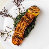 Grilled Salmon · Herb crusted, grilled/ blackened/ jerk cooking options. Served over sauteed spinach with a s...
