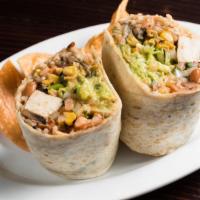 Vegetarian Burrito · A specialty veggie, rice, beans, guacamole, pico de gallo, cheese, sour cream and lettuce.