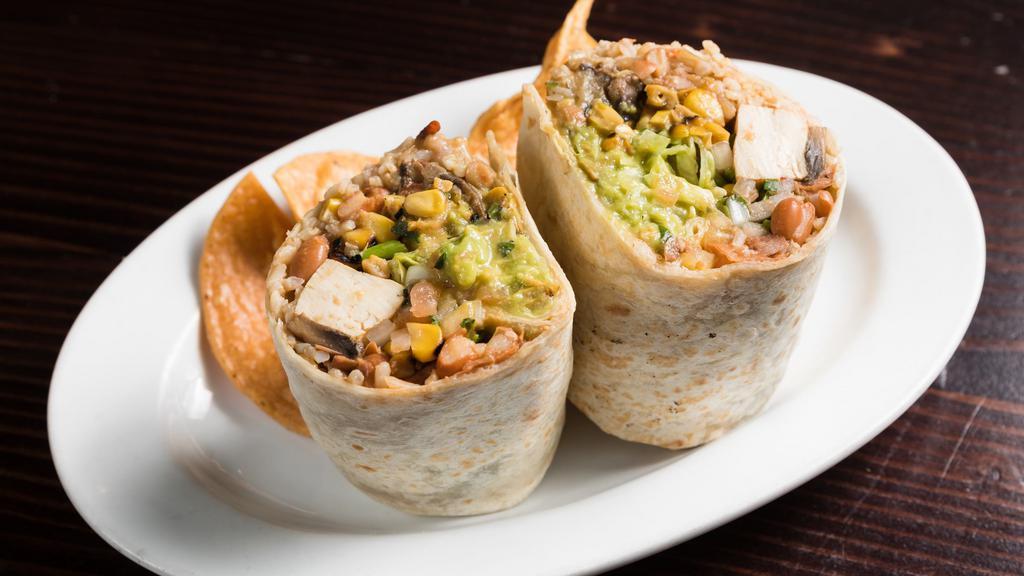 Vegetarian Burrito · A specialty veggie, rice, beans, guacamole, pico de gallo, cheese, sour cream and lettuce.