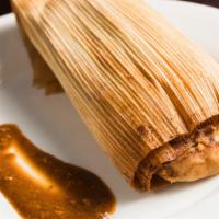 Chicken Mole Tamale · Served with warm mole sauce.