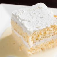 Tres Leches Cake · Sponge cake soaked in three different types of milks accompanied by whipped frosting on top....