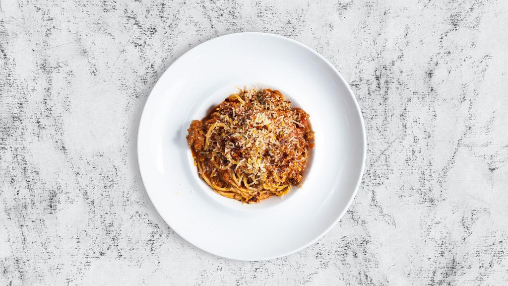 Rigatoni Bolognese · Our delicious rigatoni served with house ragú sauce and delicious Parmigiano-Reggiano cheese.
