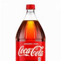 Coke · 12 oz canned soda, served cold.