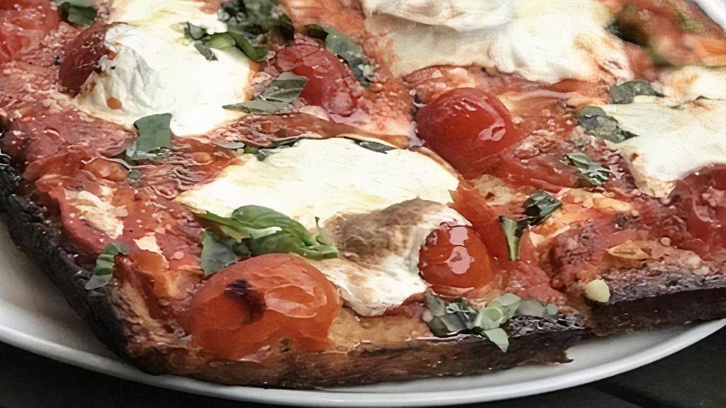 Chunky Grandma · Brooklyn style pan pizza, fresh mozzarella, topped with house marinara, cherry tomatoes, parmesan, extra virgin olive oil