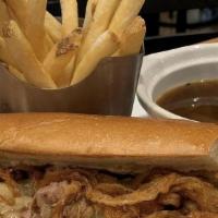French Dip · Premium cut prime rib of beef, house smoked and hand shaved with crispy onions, horseradish ...