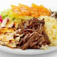 Halal Chicken & Halal Lamb Platter · Juicy halal chicken and lamb served over rice with a side of salad, house made white sauce, ...